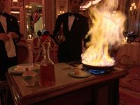 Tableside crêpes being flambéed for our pre-dessert